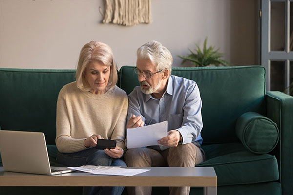 older couple calculating finances